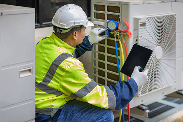 Professional Heat Pump Repair technician working in Delaware City, DE